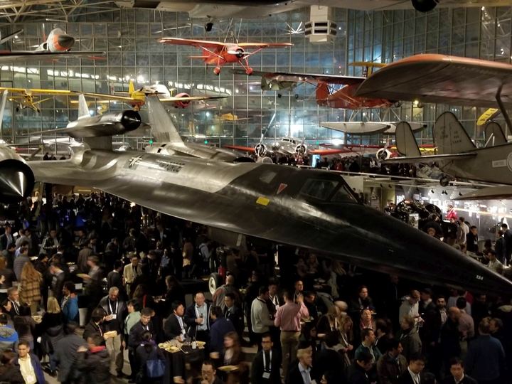 Conference attendees under an SR-71 at the APS DFD 2019 reception